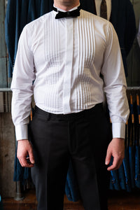 White Colin Ross formal shirt with pleated wing tip collar and cotton fabric, displayed on a hanger.