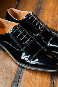 Smart Footwear black toe cap dress shoes with polished leather finish and sleek design, perfect for formal occasions.