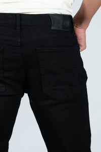 DML Deep Black Straight Fit Jeans displayed on a hanger, showcasing the sleek design and classic straight cut.