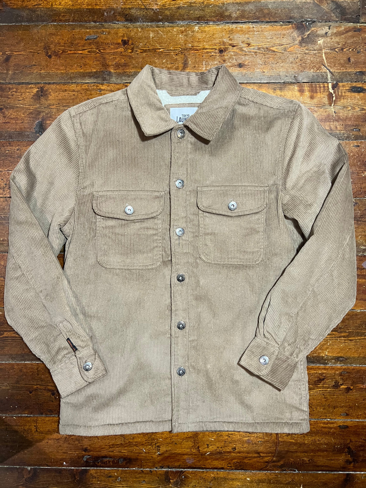 Cropley Sand Corduroy Jacket with button closure and side pockets, stylish and casual outerwear for everyday wear.