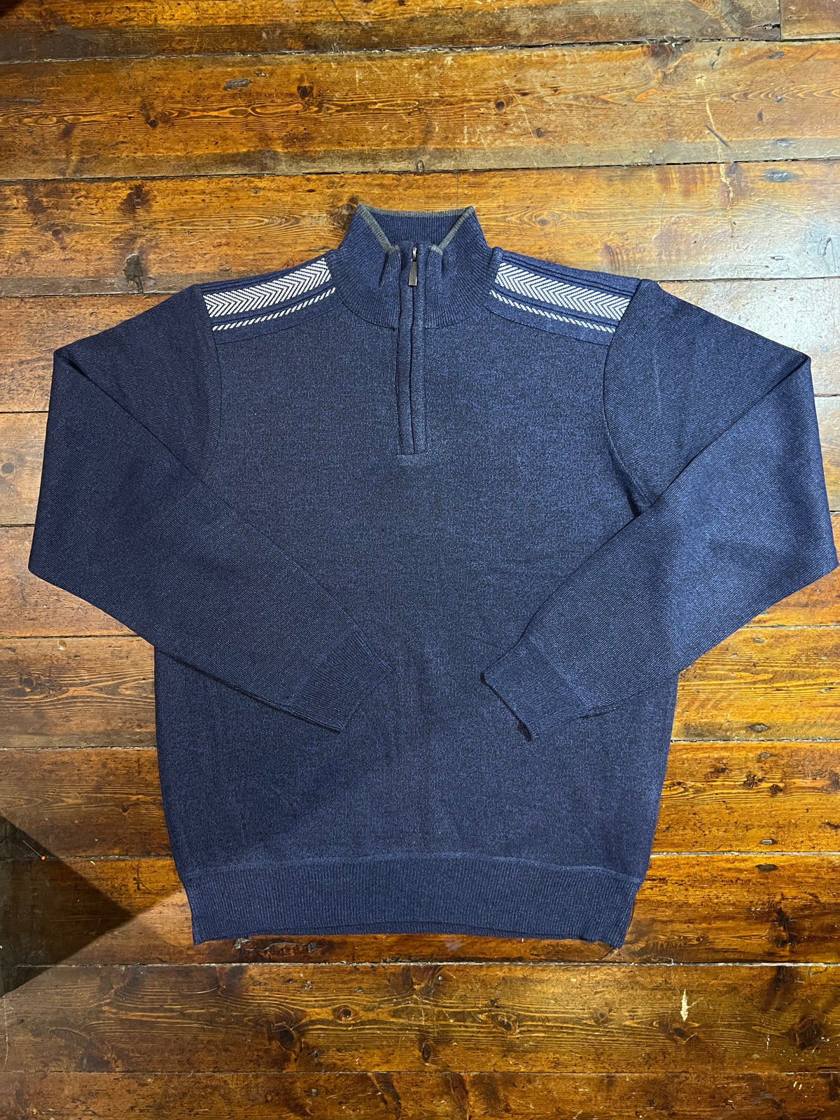 Navy Denzel half zip jumper with ribbed cuffs and collar, made from soft knit fabric, displayed on a hanger.