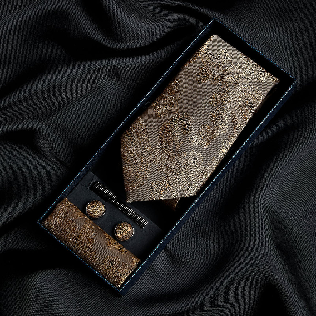 Paul Andrew gold paisley tie set featuring a luxurious silk tie with intricate paisley patterns on a gold background.