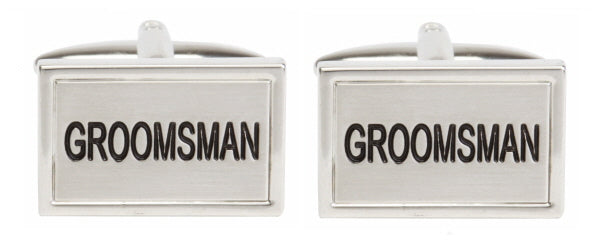 Paul Andrew groomsman cufflinks attached to a stylish tie, showcasing elegant men's accessories for special occasions.