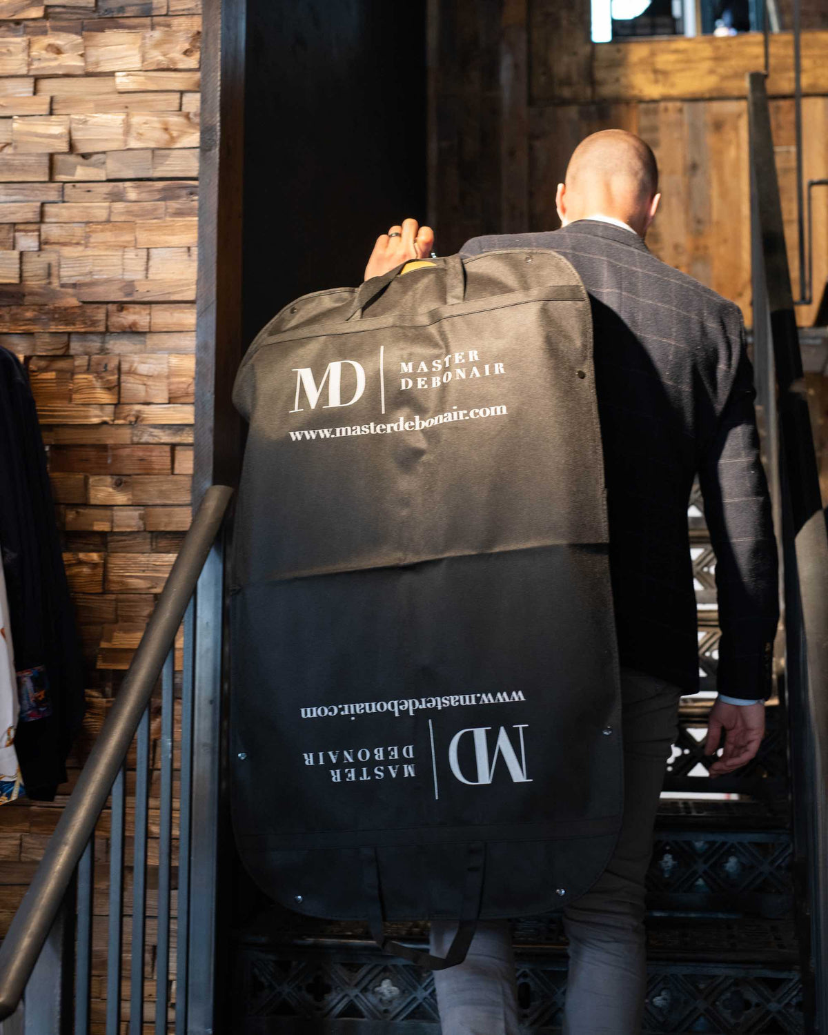Master Debonair suit carrier with padded interior, durable fabric, and zipper closure for travel and storage of suits.